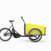 Christiania Bikes America Classic Sloped midDrive Pro I5, featuring a yellow cargo box, perfect for family outings and transporting kids or pets.